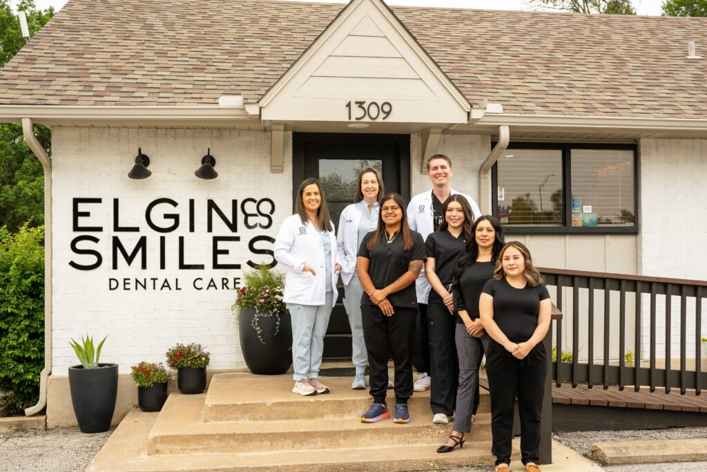 Dental team at Elgin Smiles in front of the 1309 N Avenue C office